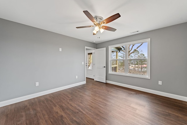 unfurnished bedroom featuring dark wood-type flooring and ceiling fan