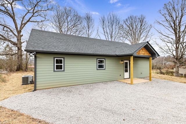 view of front of house with a patio and central AC