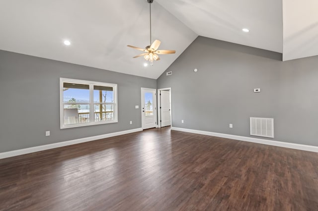 spare room featuring ceiling fan, dark hardwood / wood-style floors, and high vaulted ceiling