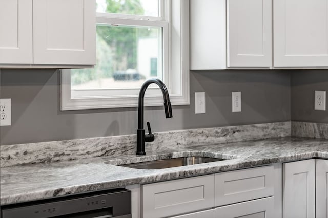 kitchen with white cabinetry, a healthy amount of sunlight, dishwasher, and sink