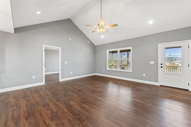 unfurnished living room with high vaulted ceiling, dark hardwood / wood-style floors, and ceiling fan