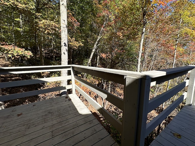deck featuring a wooded view