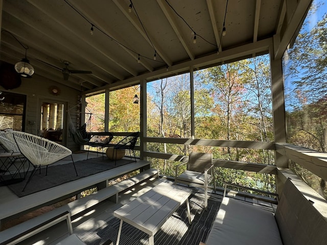 wooden deck featuring ceiling fan