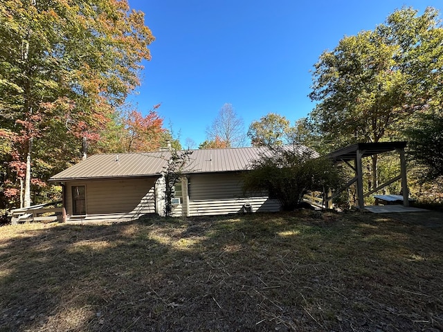 rear view of house with a yard