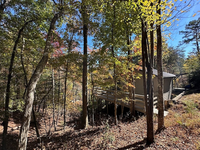 view of property exterior with a deck