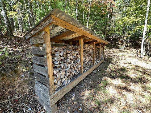 view of outdoor structure with a forest view