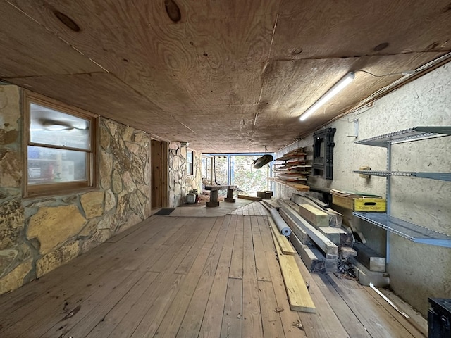 basement with wood-type flooring and wooden ceiling