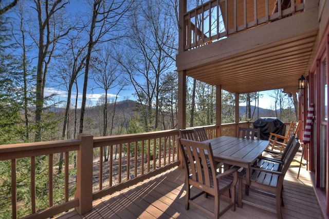 wooden deck with a mountain view