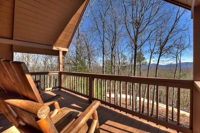 wooden deck with a mountain view