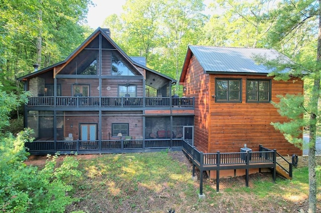 rear view of house with a wooden deck