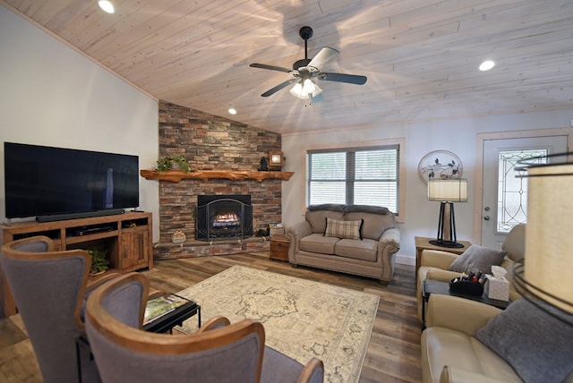 living area featuring vaulted ceiling, a stone fireplace, wooden ceiling, and wood finished floors