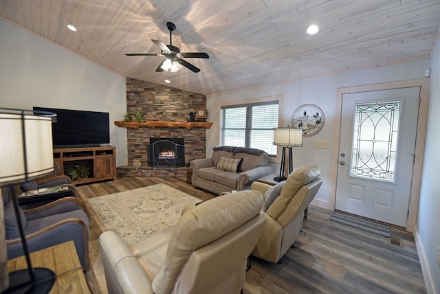 living room with lofted ceiling, wooden ceiling, wood finished floors, a stone fireplace, and recessed lighting