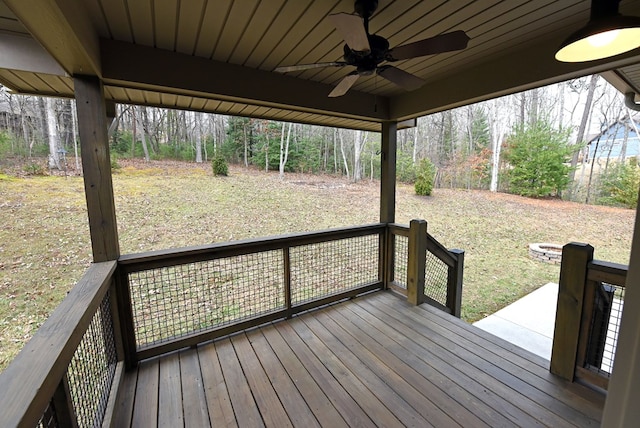 wooden deck featuring a ceiling fan