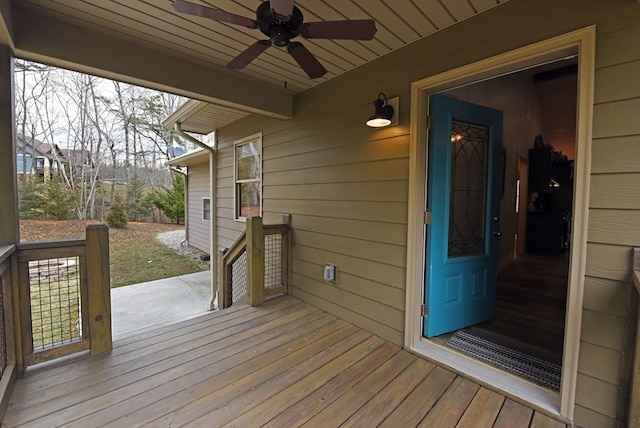 wooden deck featuring a ceiling fan