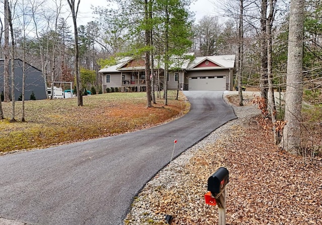 ranch-style house with driveway and an attached garage