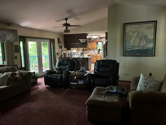 living area with carpet flooring, ceiling fan, french doors, and lofted ceiling