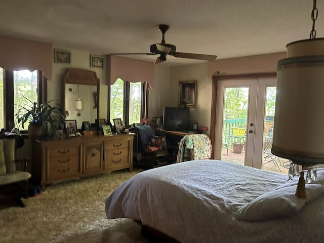 bedroom with a ceiling fan, access to exterior, and french doors