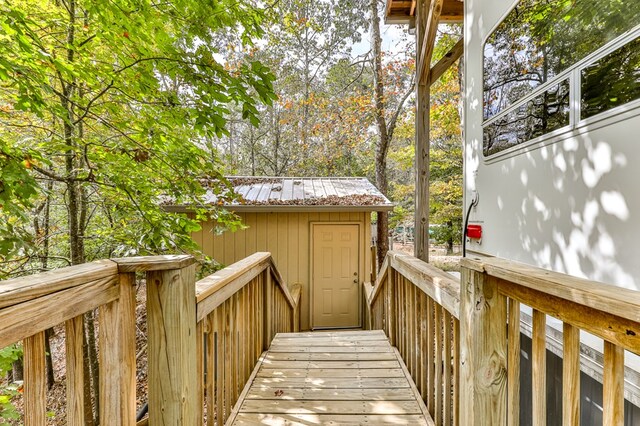 wooden deck with a shed