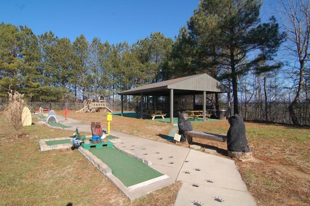 surrounding community with a playground and a lawn