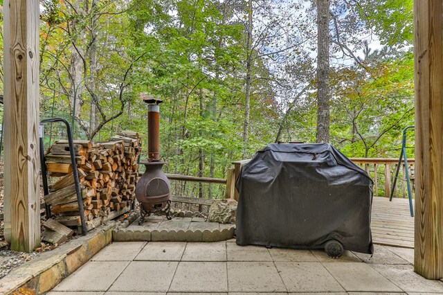 view of patio with a deck and a grill