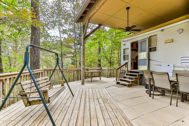 wooden deck featuring ceiling fan