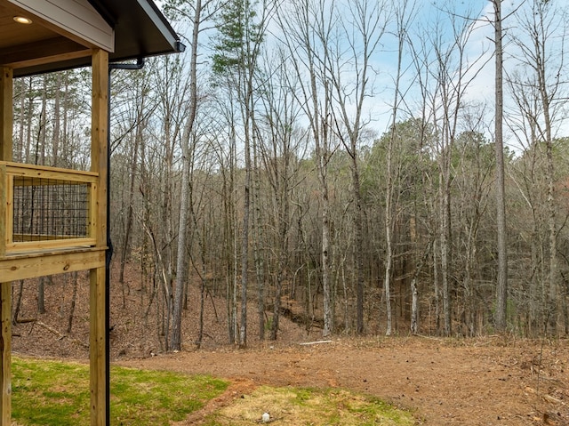 view of yard with a forest view