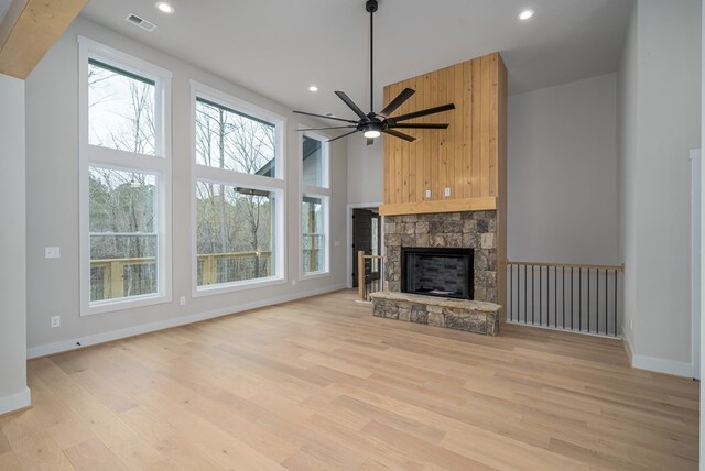 unfurnished living room with visible vents, recessed lighting, light wood-style floors, and baseboards
