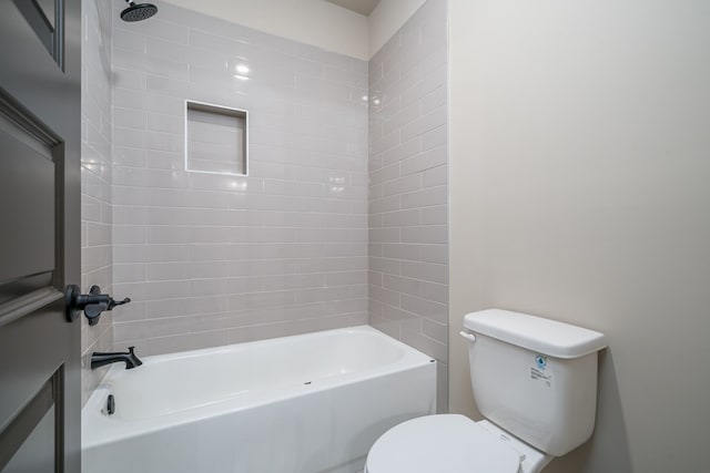 bathroom with bathing tub / shower combination and toilet