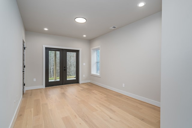 foyer with french doors, recessed lighting, baseboards, light wood-type flooring, and visible vents