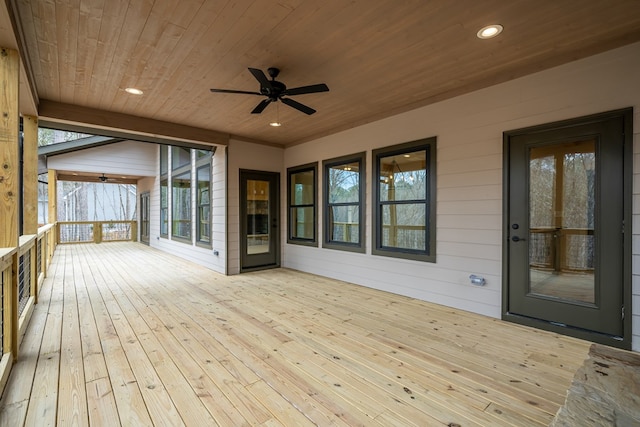 wooden deck featuring a ceiling fan