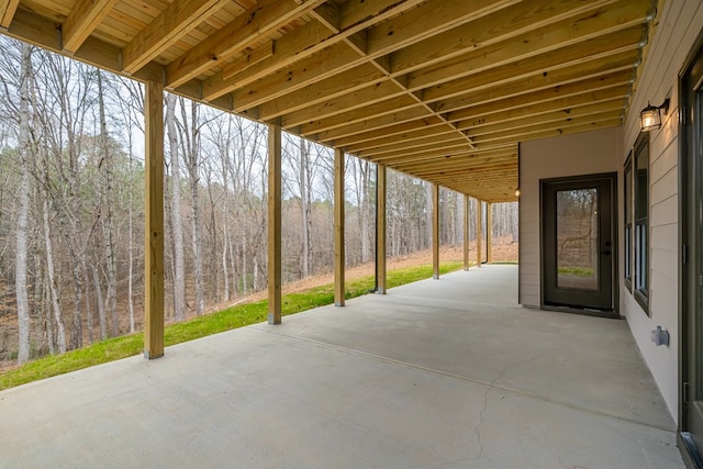 view of patio with a forest view