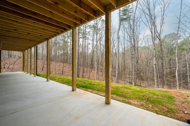 view of patio / terrace with a view of trees