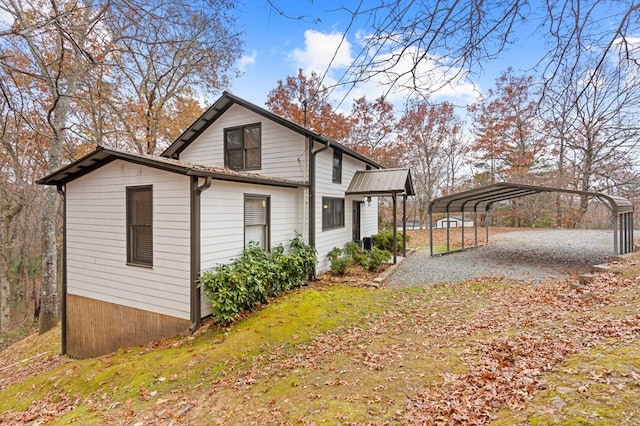 view of side of property with a carport