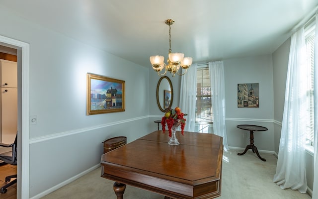 home office featuring an inviting chandelier and light carpet