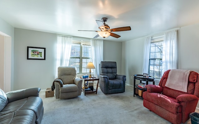 living room with light colored carpet and ceiling fan