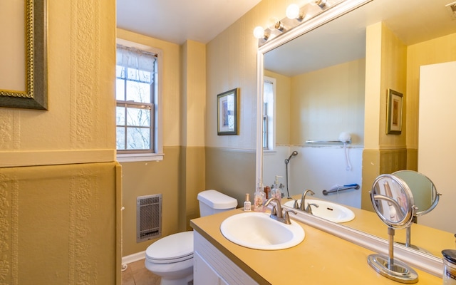 bathroom featuring tile floors, toilet, and vanity