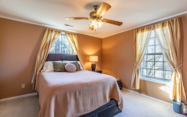 bedroom featuring crown molding, ceiling fan, and light colored carpet