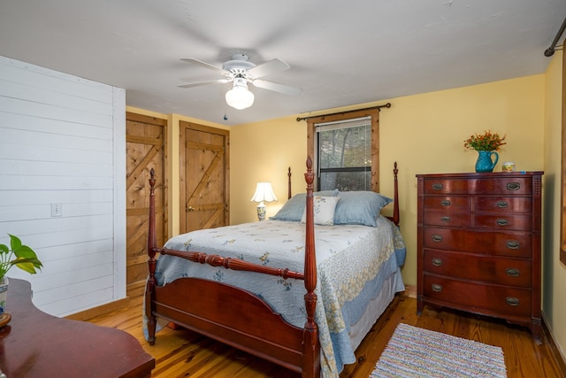 bedroom with hardwood / wood-style floors and ceiling fan