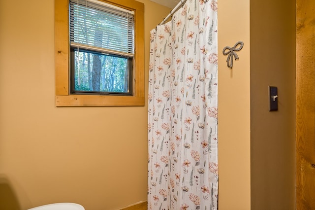 bathroom featuring walk in shower