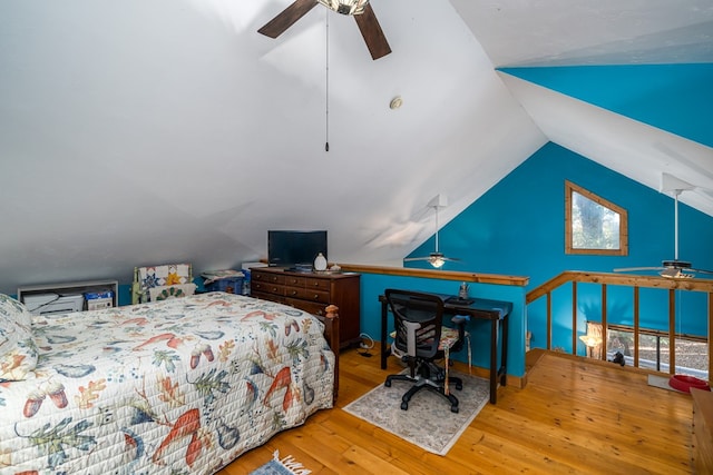 bedroom featuring lofted ceiling, light hardwood / wood-style flooring, and ceiling fan