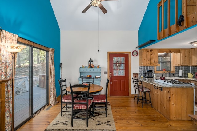 dining room featuring ceiling fan and light hardwood / wood-style flooring