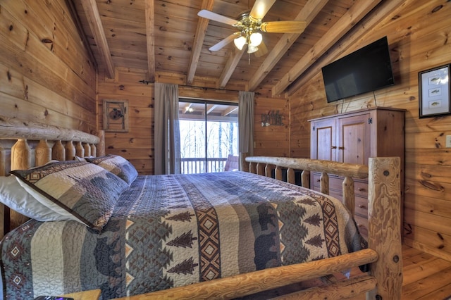 bedroom with wooden ceiling, wooden walls, and vaulted ceiling with beams