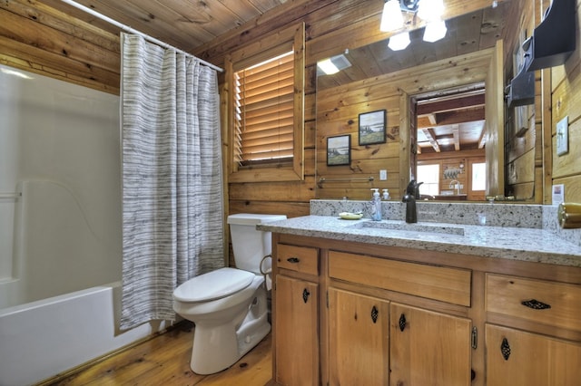 bathroom featuring vanity, shower / bath combination with curtain, wood ceiling, wood walls, and toilet