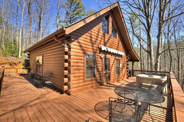 wooden terrace featuring outdoor dining area