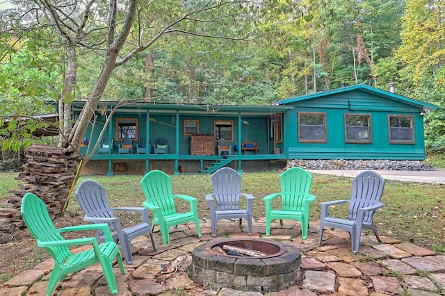 view of patio / terrace with an outdoor fire pit