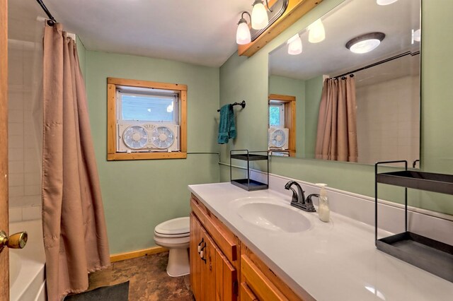 full bathroom with vanity, toilet, and shower / bath combo with shower curtain