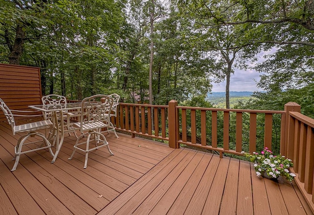 wooden deck featuring outdoor dining space