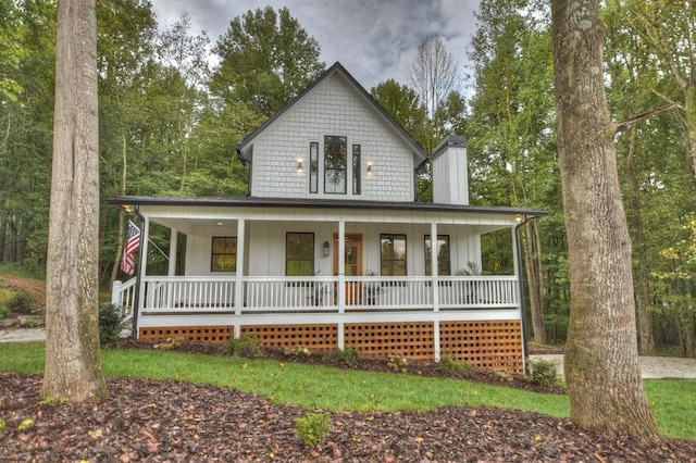 country-style home with covered porch and board and batten siding