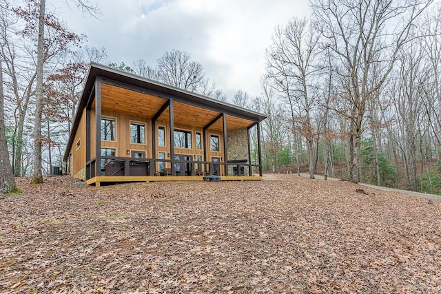 back of property with covered porch