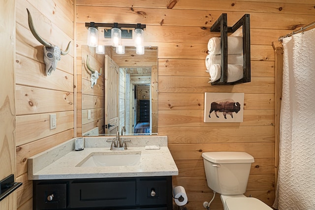 bathroom with walk in shower, vanity, toilet, and wood walls